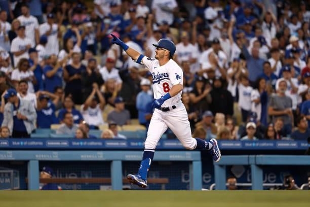 Zach McKinstry of the Los Angeles Dodgers reacts as he heads to home base after hitting a solo home run against the Chicago Cubs during the third...