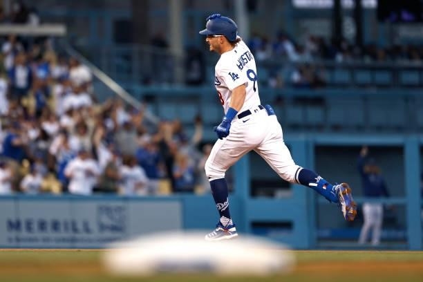 Zach McKinstry of the Los Angeles Dodgers reacts as he rounds second base after hitting a solo home run against the Chicago Cubs during the third...