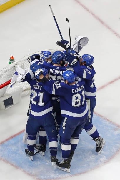 The Tampa Bay Lightning celebrate after defeating the New York Islanders 1-0 in Game Seven of the NHL Stanley Cup Semifinals during the 2021 NHL...