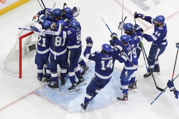 The Tampa Bay Lightning celebrate after defeating the New York Islanders 1-0 in Game Seven of the NHL Stanley Cup Semifinals during the 2021 NHL...