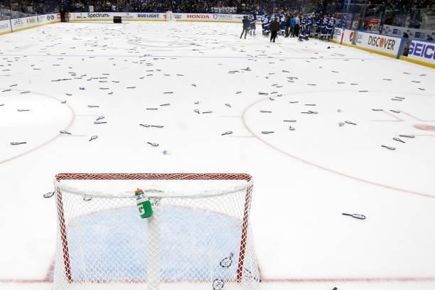 Debris is thrown on the ice by fans as the Tampa Bay Lightning celebrate their 1-0 win against the New York Islanders in Game Seven of the NHL...