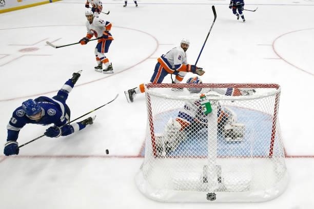 Blake Coleman of the Tampa Bay Lightning attempts a shot on Semyon Varlamov of the New York Islanders during the third period in Game Seven of the...