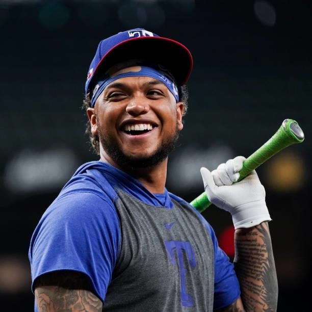 Willie Calhoun of the Texas Rangers laughs during batting practice before the game against the Kansas City Royals at Globe Life Field on June 25,...