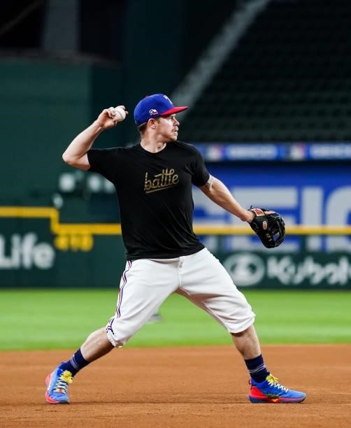 Brock Holt of the Texas Rangers throws from third before the game against the Kansas City Royals at Globe Life Field on June 25, 2021 in Arlington,...