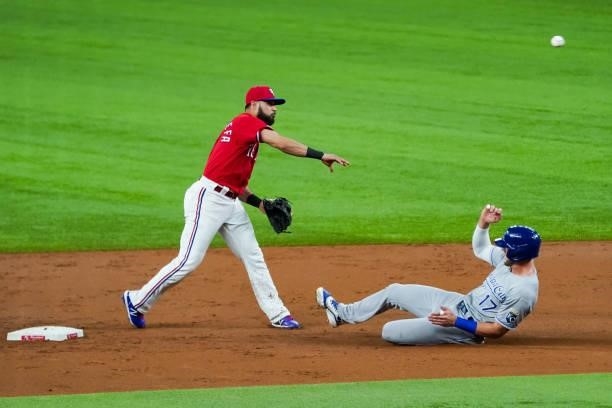 Isiah Kiner-Falefa of the Texas Rangers throws to first to throw out Hunter Dozier of the Kansas City Royals during the game against the Texas...