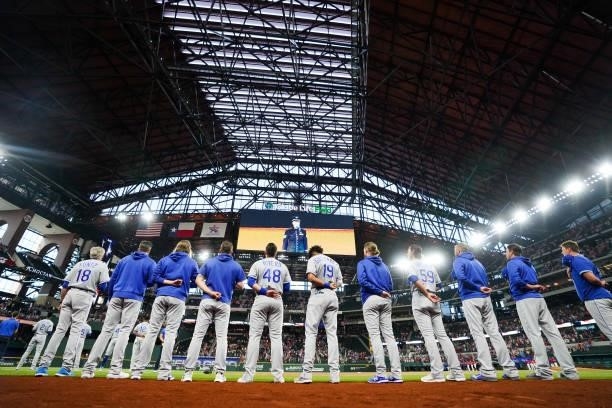The Kansas City Royals line up for the national anthem before the game against the Texas Rangers at Globe Life Field on June 25, 2021 in Arlington,...