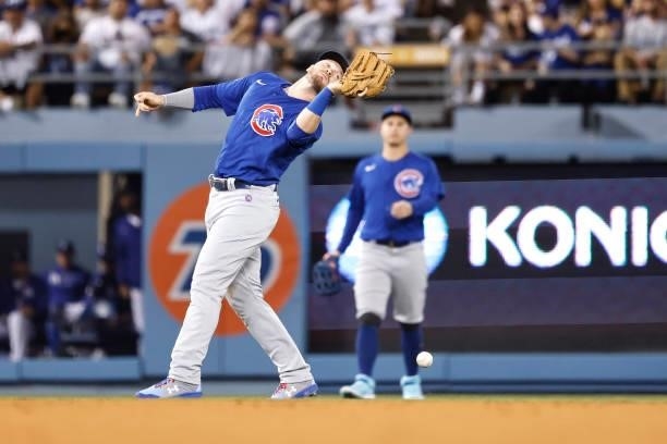 Ian Happ of the Chicago Cubs makes a fielding error against the Los Angeles Dodgers during the fifth inning at Dodger Stadium on June 25, 2021 in Los...