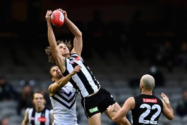 Chris Mayne of the Magpies marks during the round 15 AFL match between the Collingwood Magpies and the Fremantle Dockers at Marvel Stadium on June...