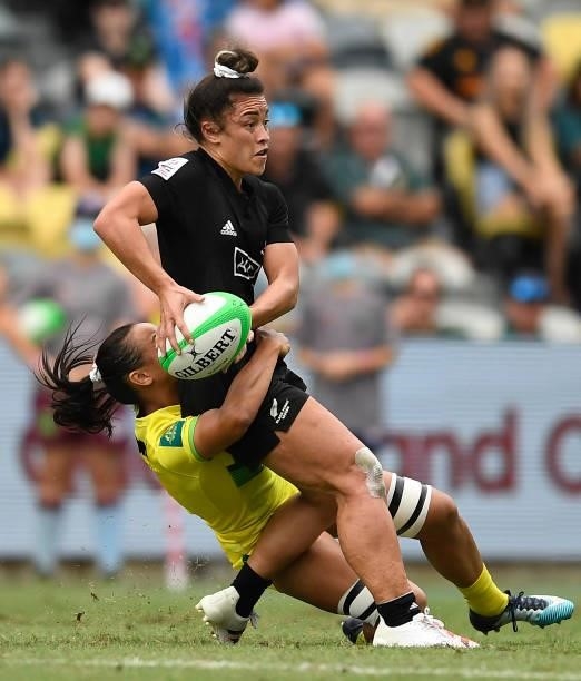 Theresa Fitzpatrick of New Zealand is tackled during the Oceania Sevens Challenge match between New Zealand and Australia at Queensland Country Bank...