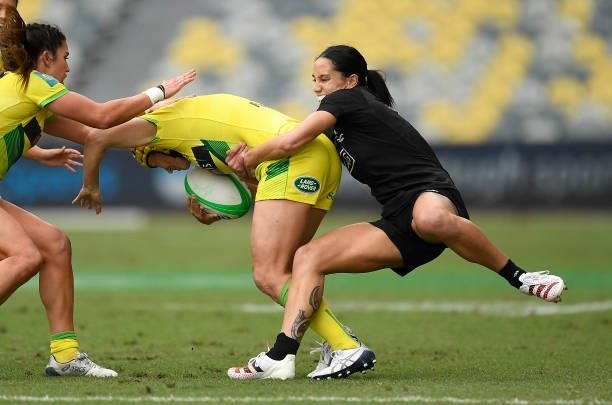Shannon Parry of Australia is tackled by Shiray Tane of New Zealand during the Oceania Sevens Challenge match between New Zealand and Australia at...