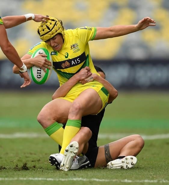 Shannon Parry of Australia is tackled by Shiray Tane of New Zealand during the Oceania Sevens Challenge match between New Zealand and Australia at...