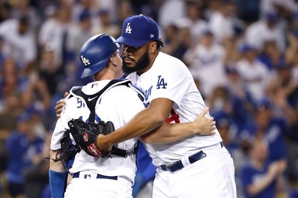 Kenley Jansen of the Los Angeles Dodgers celebrates with Will Smith of the Los Angeles Dodgers after defeating the Chicago Cubs, 6-2, during the...