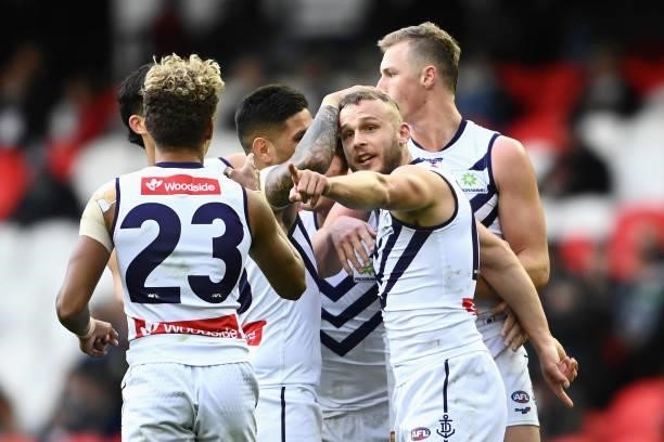 Brett Bewley of the Dockers celebrates kicking a goal with team mates during the round 15 AFL match between the Collingwood Magpies and the Fremantle...