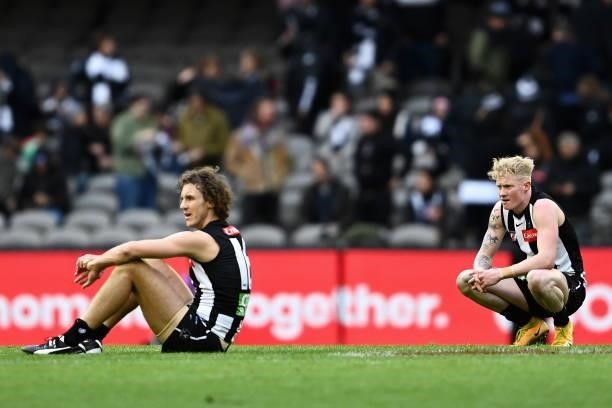 Chris Mayne of the Magpies and John Noble of the Magpies look dejected after losing the round 15 AFL match between the Collingwood Magpies and the...