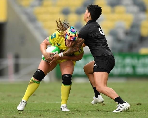 Sharni Williams of Australia is tackled by Gayle Broughton of New Zealand during the Oceania Sevens Challenge match between New Zealand and Australia...