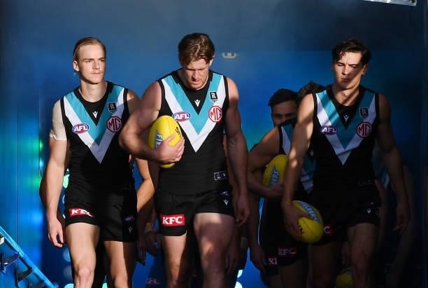 Tom Jonas of Port Adelaide leads his team out of their race during the round 15 AFL match between the Port Adelaide Power and the Sydney Swans at...