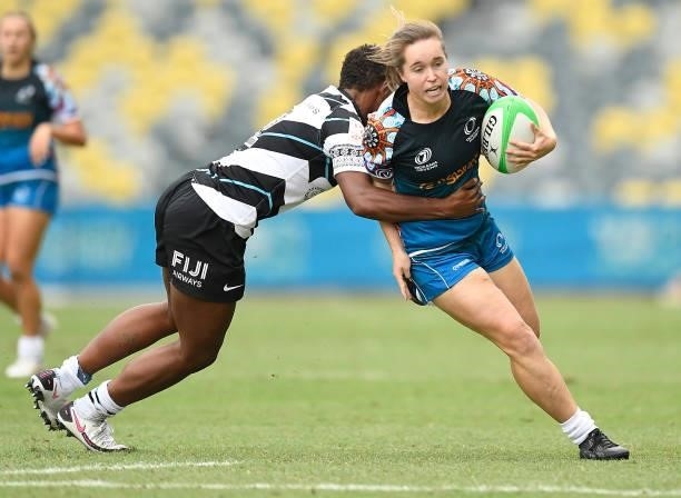 Tia Hinds of Oceania is tackled by Vani Buleki of Fiji during the Oceania Sevens Challenge match between Fiji and Oceania at Queensland Country Bank...