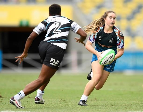 Tia Hinds of Oceania is runs the ball during the Oceania Sevens Challenge match between Fiji and Oceania at Queensland Country Bank Stadium on June...