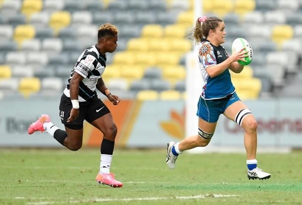 Dominique Du Toit of Oceania runs the ball during the Oceania Sevens Challenge match between Fiji and Oceania at Queensland Country Bank Stadium on...
