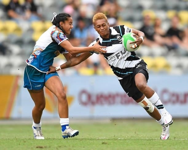 Aloesi Nakoci of Fiji is tackled by Kiiahla Duff of Oceania during the Oceania Sevens Challenge match between Fiji and Oceania at Queensland Country...