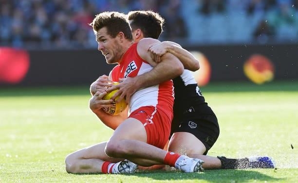 Luke Parker of the Swans marks in front of Karl Amon of Port Adelaide during the round 15 AFL match between the Port Adelaide Power and the Sydney...