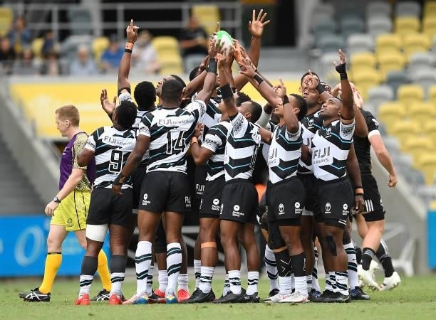 The Fijian team stand in a huddle during the Oceania Sevens Challenge match between New Zealand and Fiji at Queensland Country Bank Stadium on June...