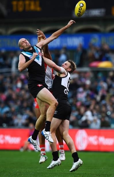 Jarrod Lienert of Port Adelaide punchs the ball out of bounds during the round 15 AFL match between the Port Adelaide Power and the Sydney Swans at...