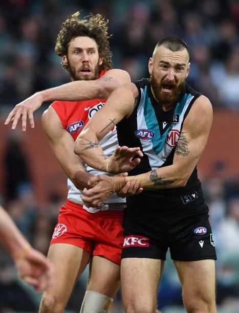 Tom Hickey of the Swans rucks against Charlie Dixon of Port Adelaide during the round 15 AFL match between the Port Adelaide Power and the Sydney...