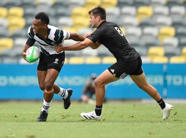 Sireli Maqala of Fiji is tackled by Andrew Knewstubb of New Zealand during the Oceania Sevens Challenge match between New Zealand and Fiji at...