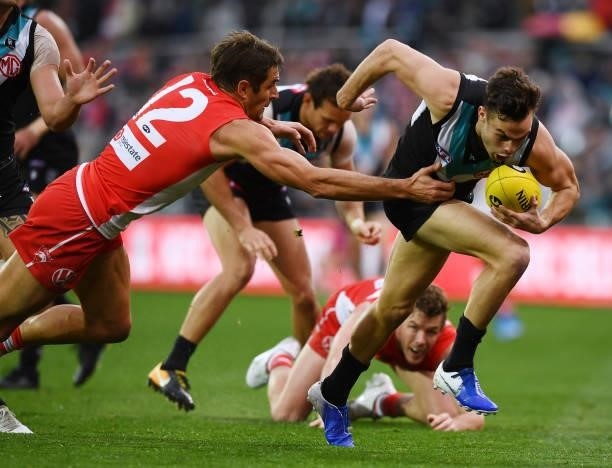 Karl Amon of Port Adelaide breaks away from Josh Kennedy of the Swans during the round 15 AFL match between the Port Adelaide Power and the Sydney...