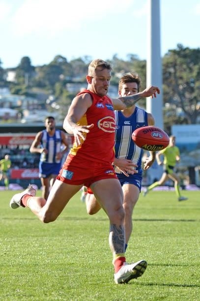 Brandon Ellis of the Suns kicks the ball during the round 15 AFL match between the North Melbourne Kangaroos and the Gold Coast Suns at Blundstone...