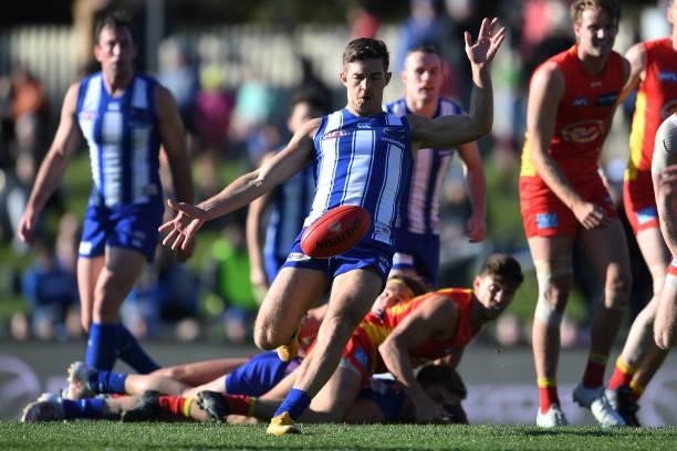 Trent Dumont of the Kangaroos kicks the ball during the round 15 AFL match between the North Melbourne Kangaroos and the Gold Coast Suns at...