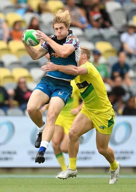 Angus Bell of Oceania is tackled by Lachlan Miller of Australia during the Oceania Sevens Challenge match between Australia and Oceania at Queensland...