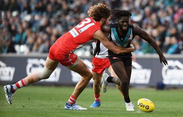 Martin Frederick of Port Adelaide tackled by Tom Hickey of the Swans during the round 15 AFL match between the Port Adelaide Power and the Sydney...