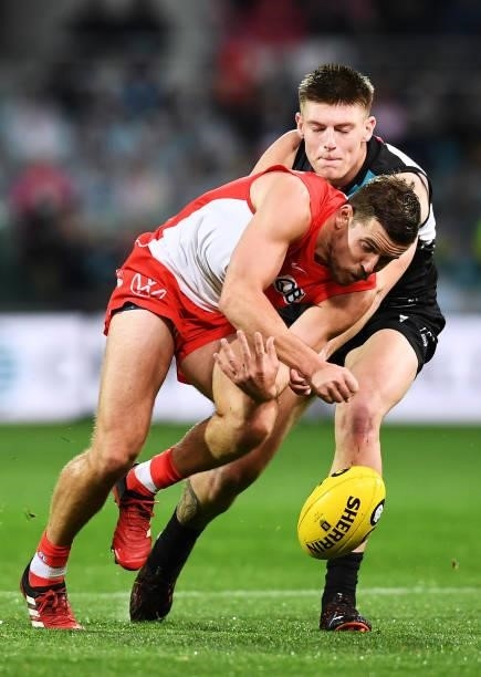 Jake Lloyd of the Swans competes with Dylan Williams of Port Adelaide during the round 15 AFL match between the Port Adelaide Power and the Sydney...