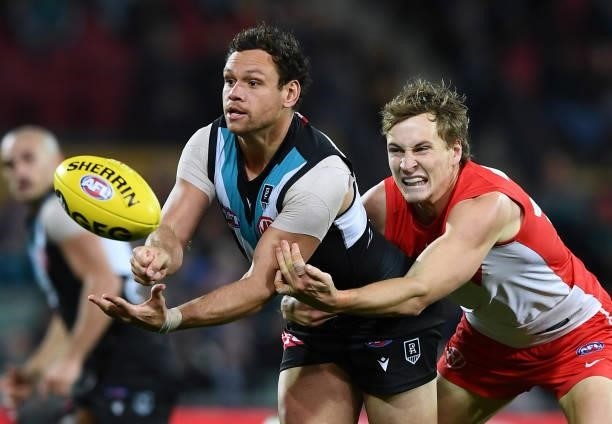 Steven Motlop of Port Adelaide handballs during the round 15 AFL match between the Port Adelaide Power and the Sydney Swans at Adelaide Oval on June...
