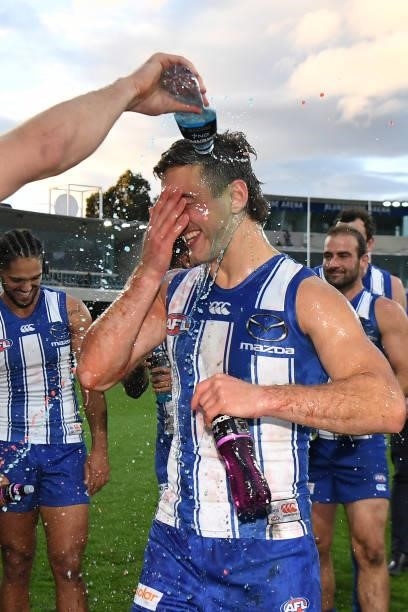 Will Phillips of the Kangaroos celebrates after the win during the round 15 AFL match between the North Melbourne Kangaroos and the Gold Coast Suns...