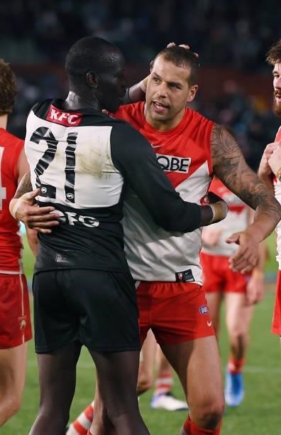 Aliir Aliir of Port Adelaide and Lance Franklin of the Swans hug at end of game during the round 15 AFL match between the Port Adelaide Power and the...
