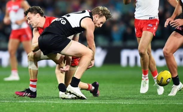 Will Hayward of the Swans and Trent McKenzie of Port Adelaide collide during the round 15 AFL match between the Port Adelaide Power and the Sydney...