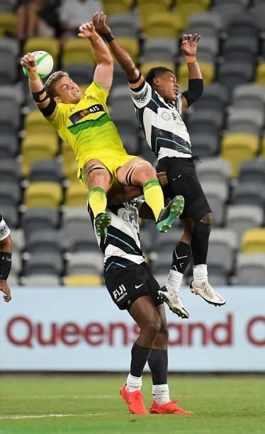 Nick Malouf of Australia contest the ball with Napolioni Bolaca and Kavekini Tabu of Fiji during the Oceania Sevens Challenge match between Fiji and...