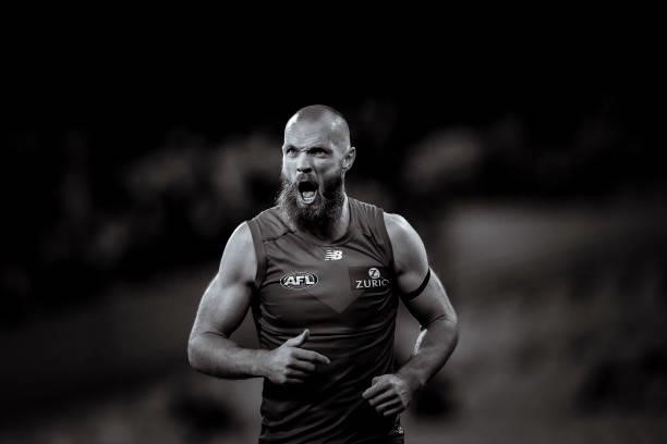 Max Gawn of the Demons reacts after receiving a knock to his face in a marking contest during the round 15 AFL match between the Essendon Bombers and...