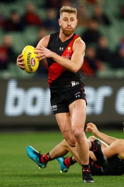 Dyson Heppell of the Bombers runs with the ball during the round 15 AFL match between the Essendon Bombers and the Melbourne Demons at Melbourne...