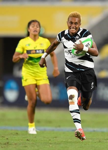 Aloesi Nakoci of Fiji makes a break to score a try during the Oceania Sevens Challenge match between Australia and Fiji at Queensland Country Bank...