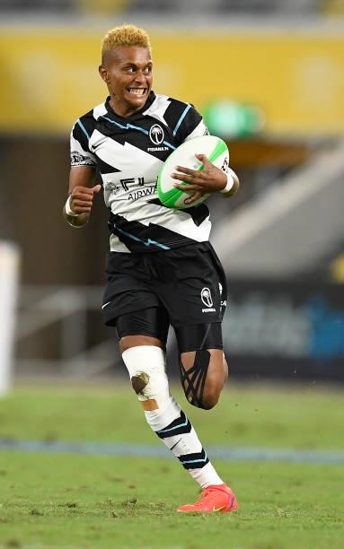 Aloesi Nakoci of Fiji makes a break to score a try during the Oceania Sevens Challenge match between Australia and Fiji at Queensland Country Bank...