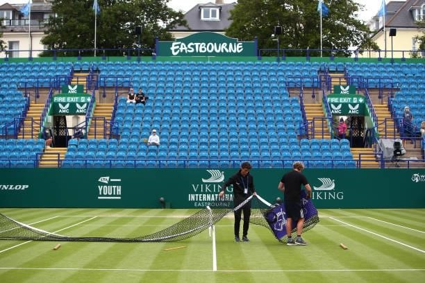 Ground staff prep center court ahead of the final round of matchs during day 8 of the Viking International Eastbourne at Devonshire Park on June 26,...