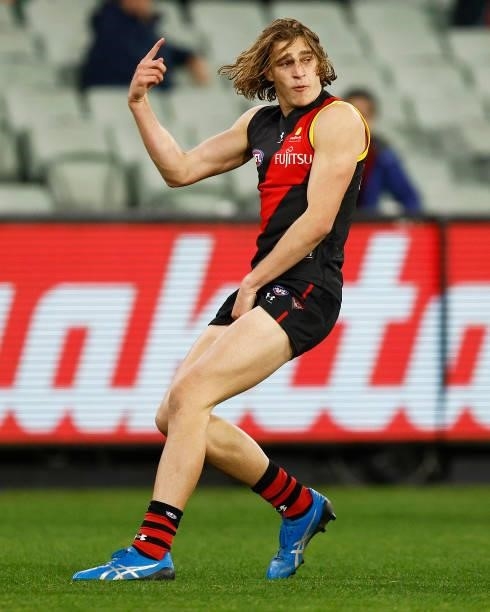 Harrison Jones of the Bombers celebrates a goal during the round 15 AFL match between the Essendon Bombers and the Melbourne Demons at Melbourne...