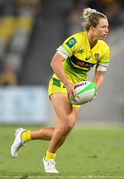 Emma Tonegato of Australia runs the ball during the Oceania Sevens Challenge match between Australia and Fiji at Queensland Country Bank Stadium on...