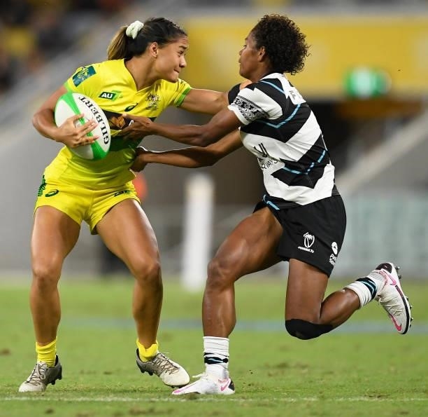 Faith Nathan of Australia is tackled by Laisana Likuceva of Fiji during the Oceania Sevens Challenge match between Australia and Fiji at Queensland...