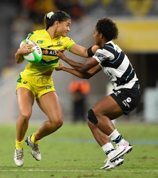 Faith Nathan of Australia is tackled by Laisana Likuceva of Fiji during the Oceania Sevens Challenge match between Australia and Fiji at Queensland...
