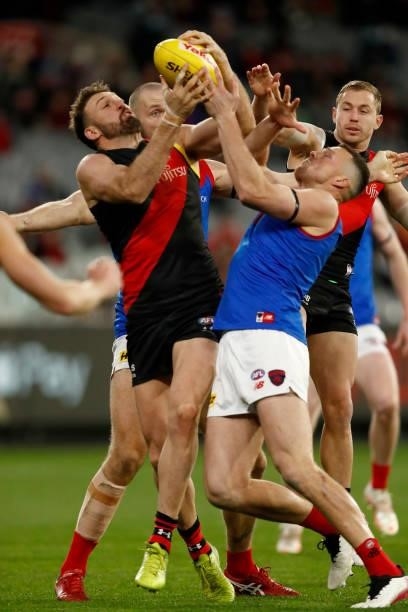 Cale Hooker of the Bombers and Steven May of the Demons compete for the ball during the round 15 AFL match between the Essendon Bombers and the...